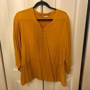Pumpkin colored peplum top
